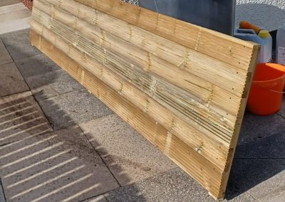 A planter side panel built from decking boards