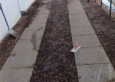Path base being laid during a side garden path build
