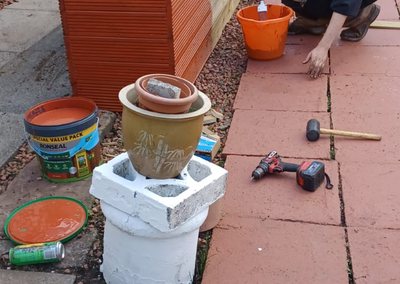 The team staining the new timber planter